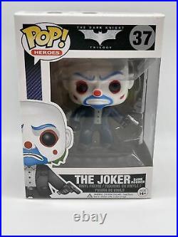 Funko Pop! The Joker Bank Robber #37 The Dark Knight. Pop has paint defect