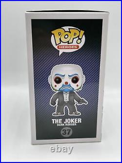 Funko Pop! The Joker Bank Robber #37 The Dark Knight. Pop has paint defect