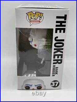 Funko Pop! The Joker Bank Robber #37 The Dark Knight. Pop has paint defect